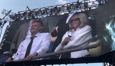 French President Emmanuel Macron and first lady Brigitte Macron are featured on the giant screen during a BTS concert at the Stade de France in Paris, Friday (local time). Captured from X (formerly Twitter)
