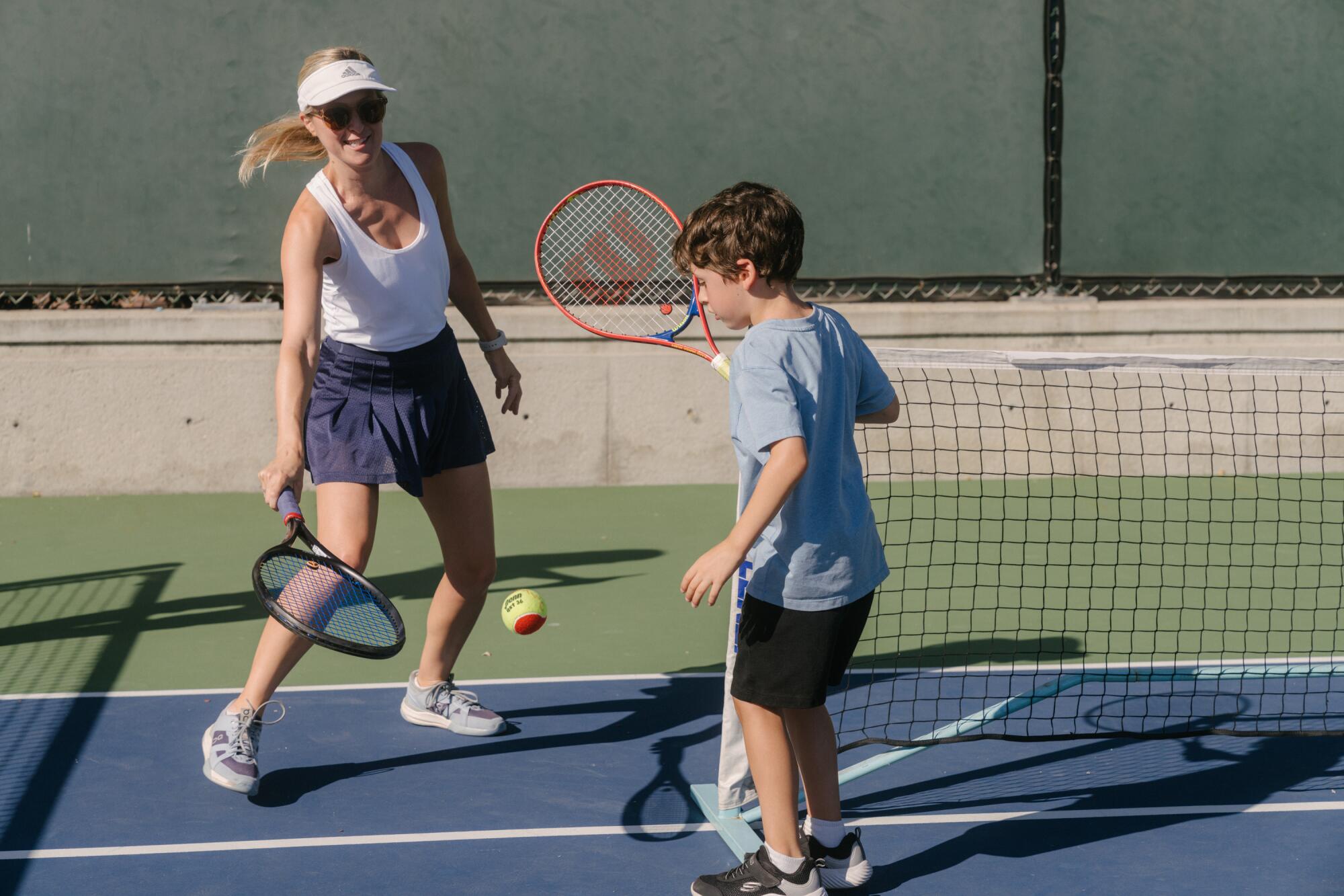 Nicole LeVine practices with her son, Roman, 7.