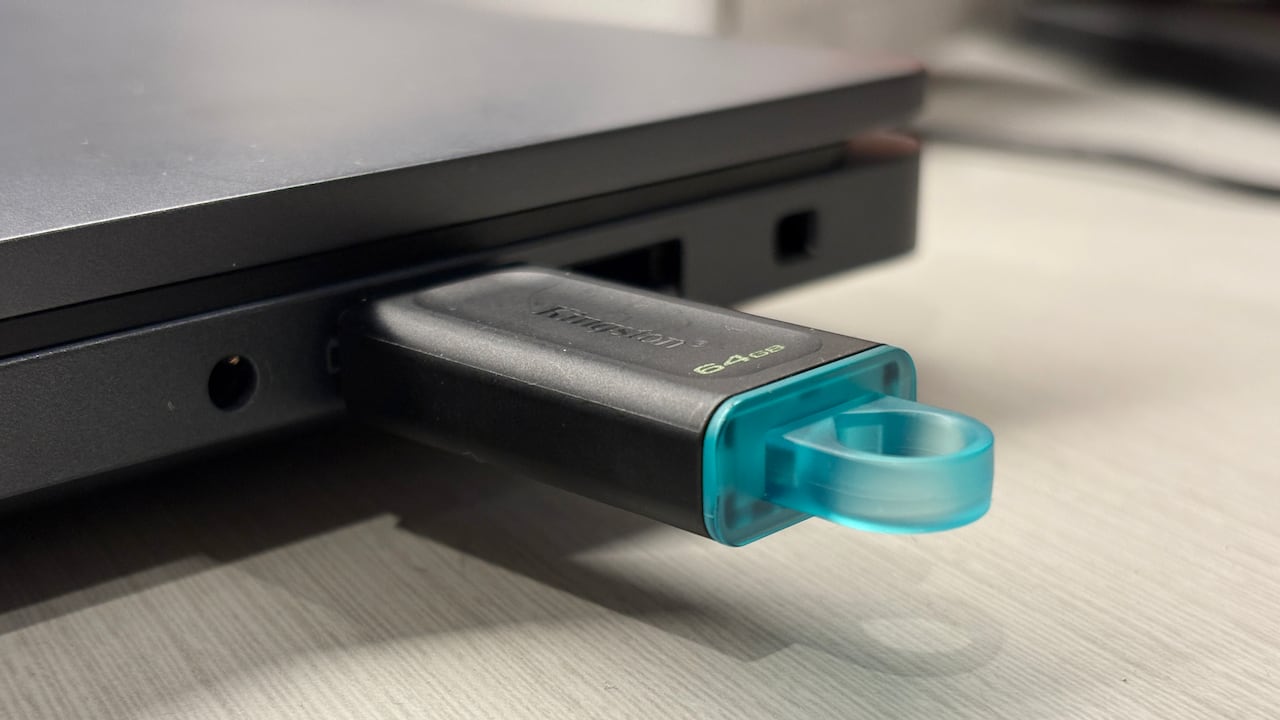 A USB key plugged into a laptop.