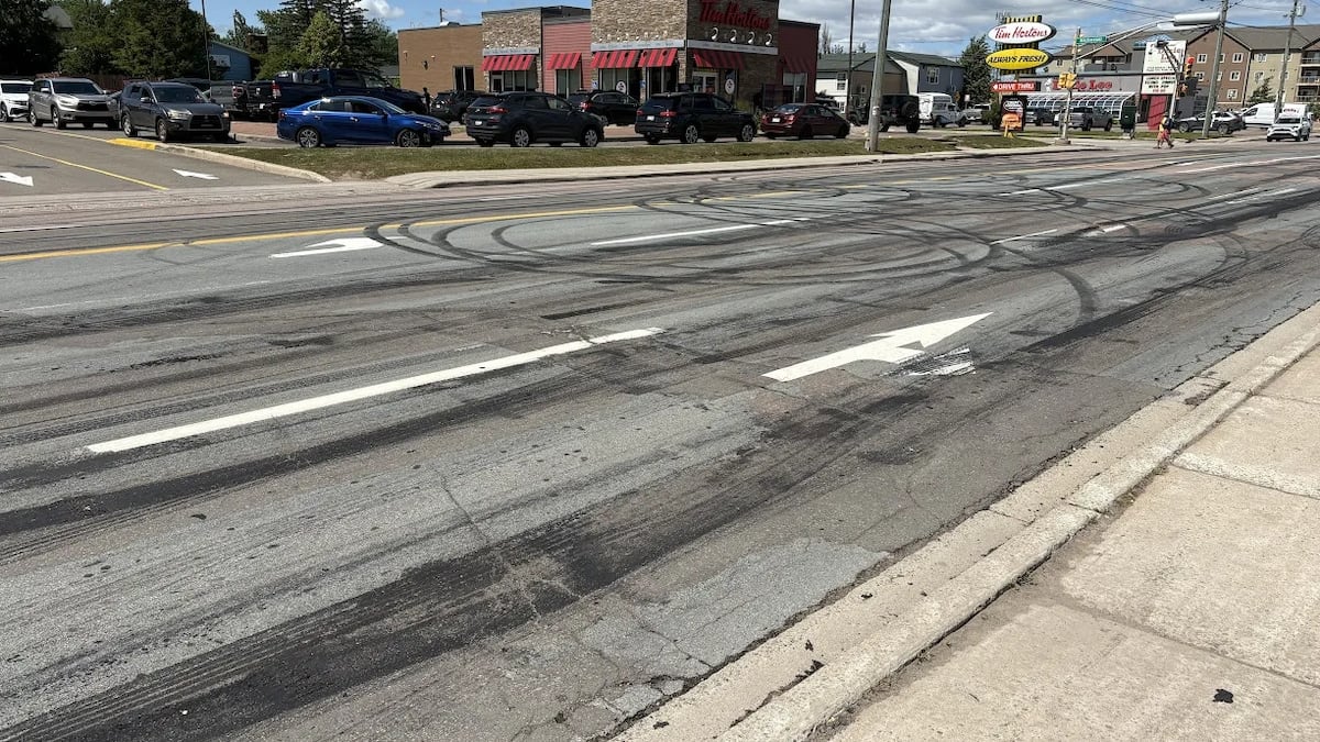 A street with black tire marks across it