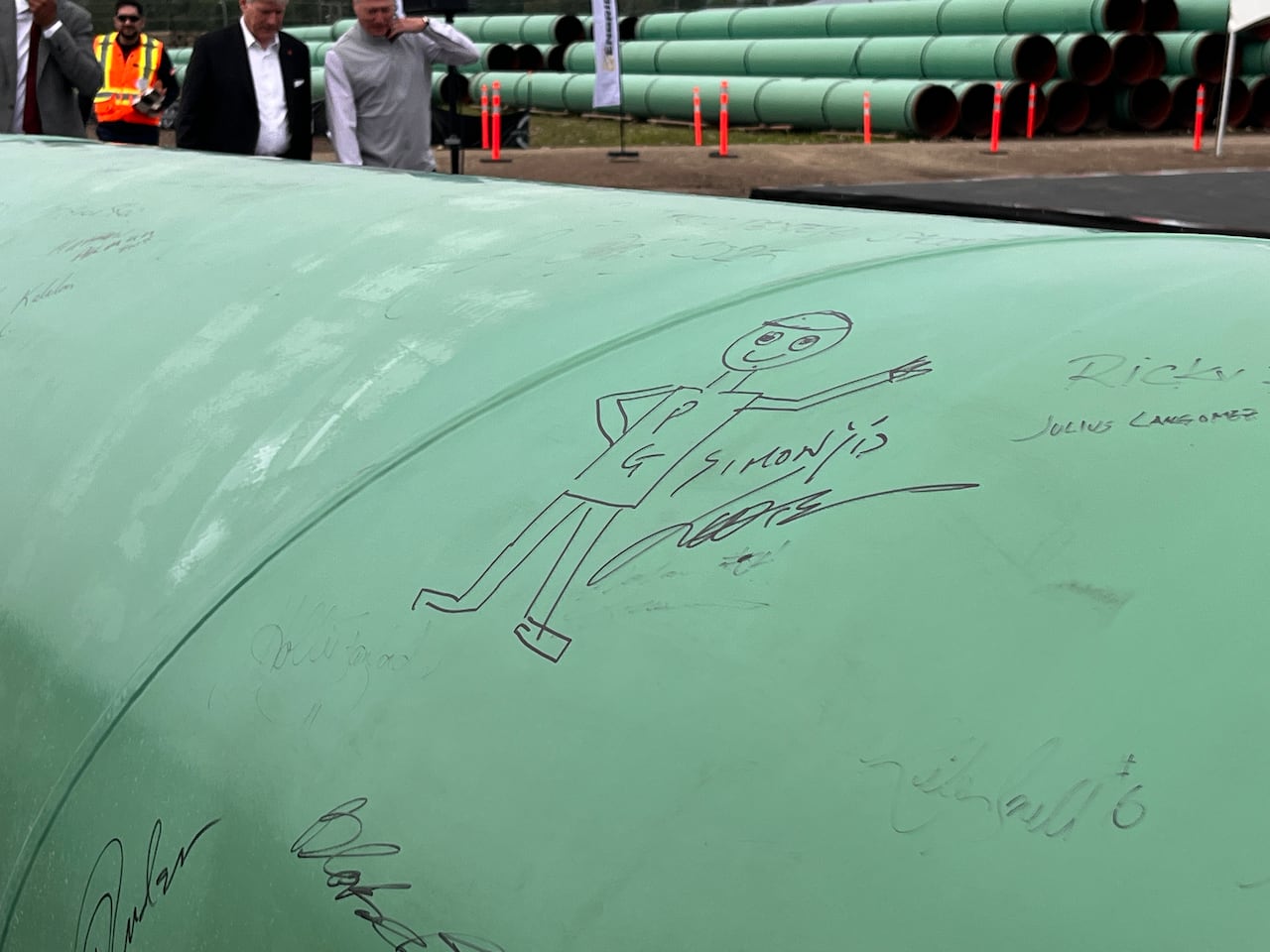 A close up image of a pipeline with a drawing of Mr. PG the mascot of the city of Prince George.