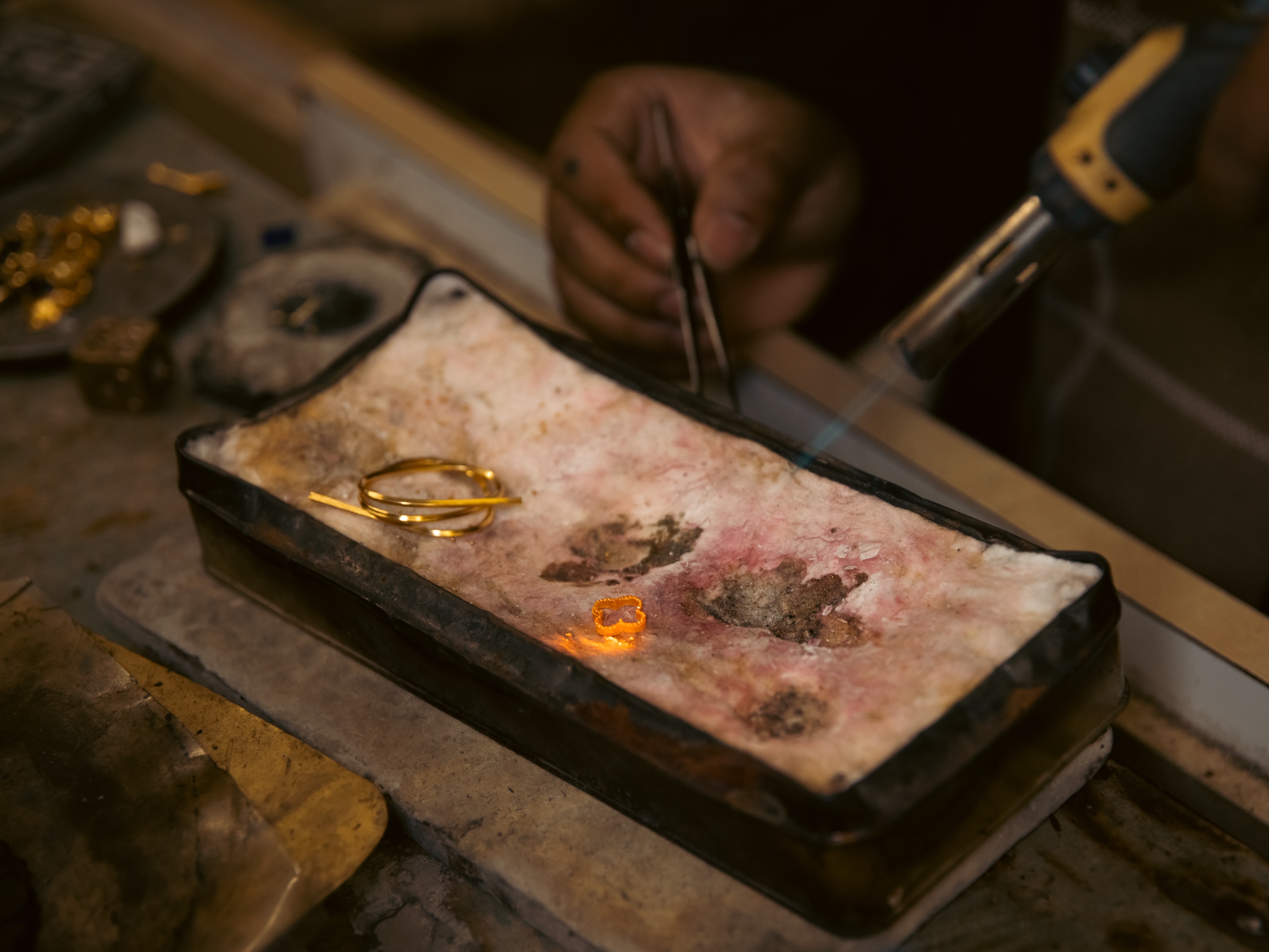 Binod Biswa, the co-owner of a jewelry shop in Harrisburg, Pa., produces and repairs gold pieces on April 16, 2025. He learned the craft from his uncle, who co-owns the store.