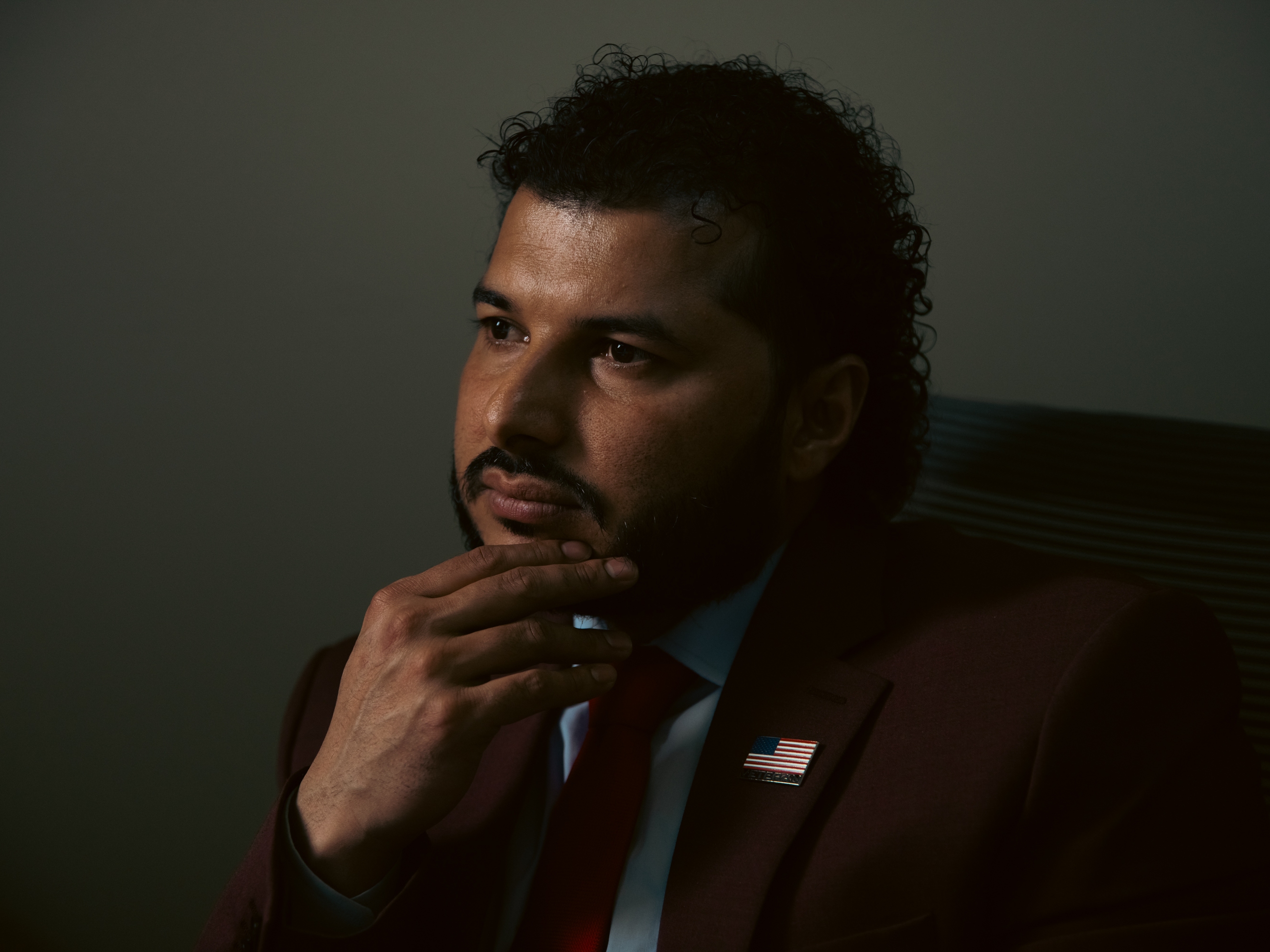 Binay Luitel poses for a portrait in his office in Ghimire Homes real estate brokerage, in Harrisburg, Pa., on April 16, 2025. Luitel, a U.S. Army veteran, works to find homes for members of his community.