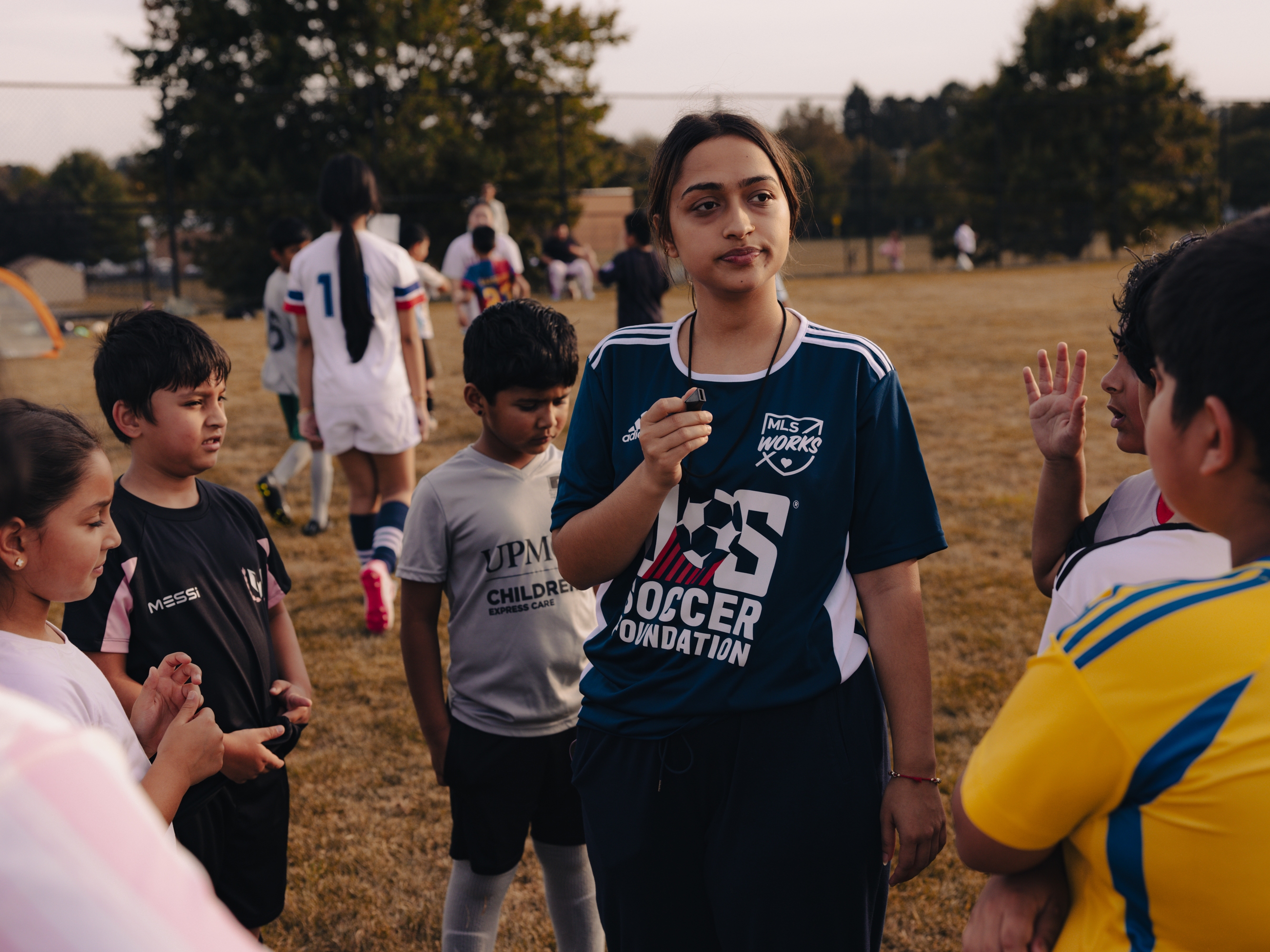 Nirjala Timsina, a coach with ARU's Soccer for Success program, works with a group of young players in Harrisburg, Pa., on Sept. 15, 2025.