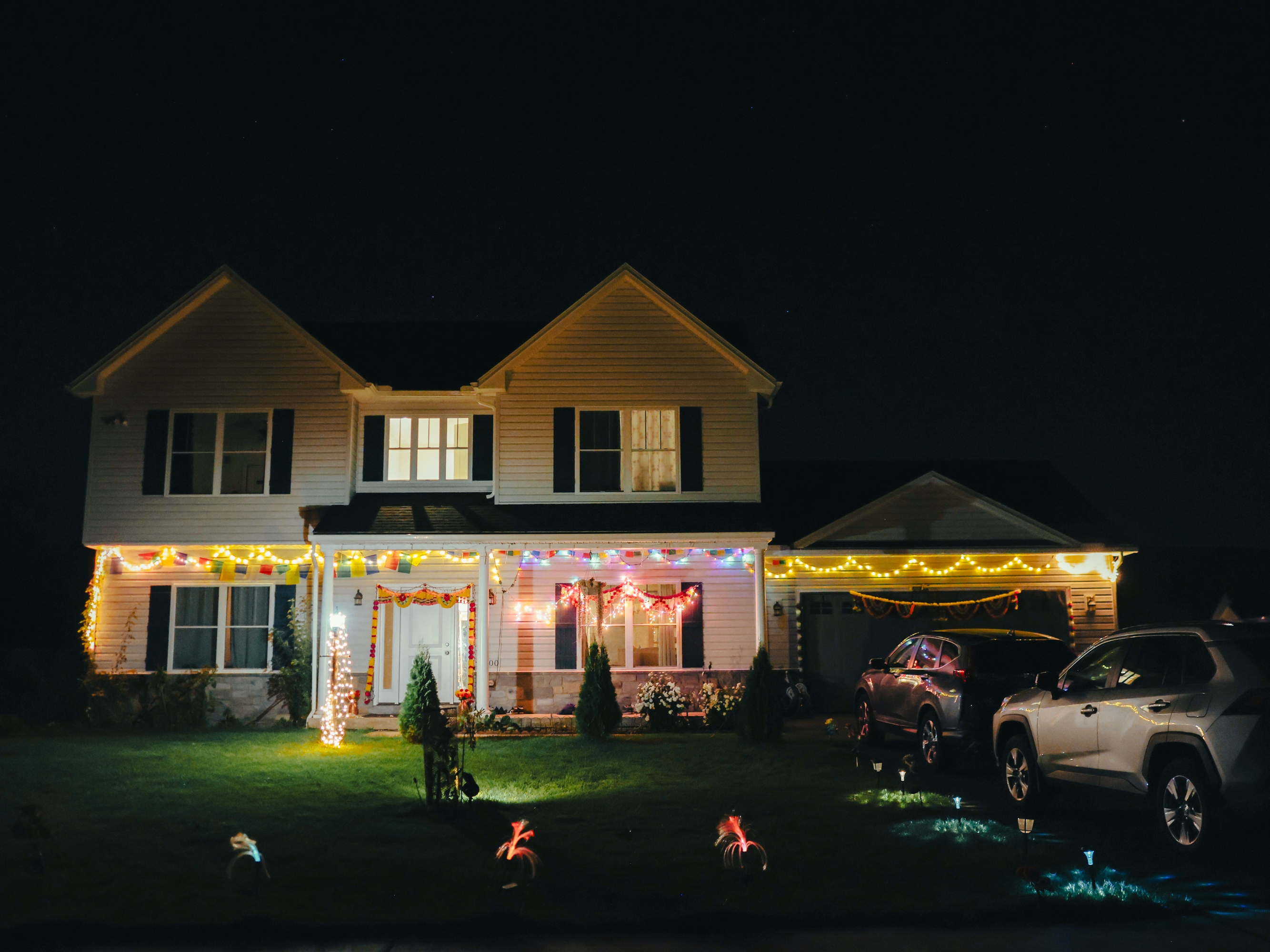 Manju Gurung's family home is decorated with lights and decorations in honor of Tihar, the Hindu festival of lights and animals, in Mount Holly Springs, Pa., on Oct. 23, 2025. A part-time volunteer coach for the Soccer for Success program, Gurung also helps lead the civic engagement arm of ARU to educate their community on their rights and voting power.