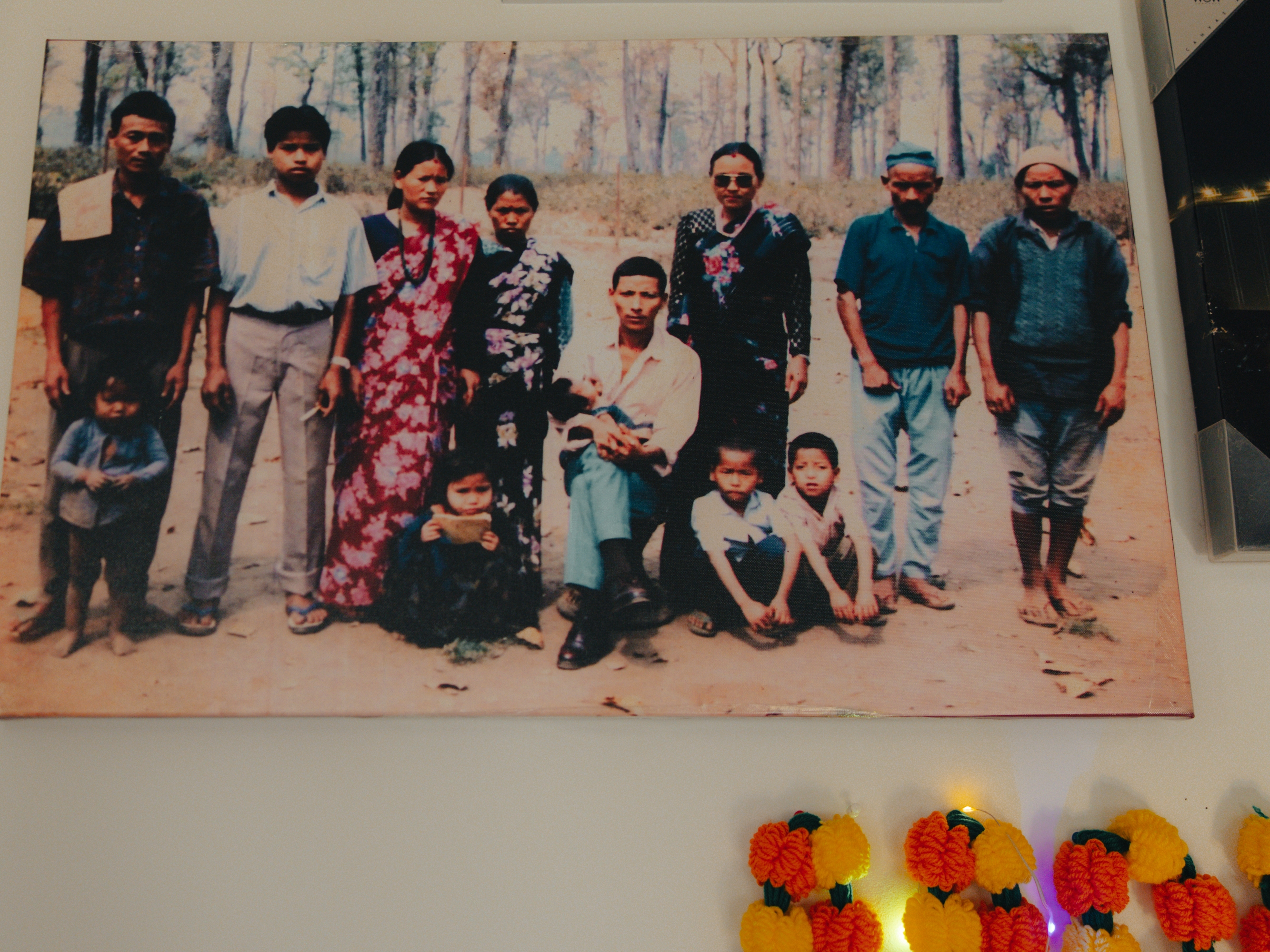 Manju Gurung's family keeps a portrait from their time in the camps, as seen in their home amid holiday festivities in honor of Tihar, the Hindu festival of lights and animals, in Mount Holly Springs, Pa., on Oct. 23, 2025.