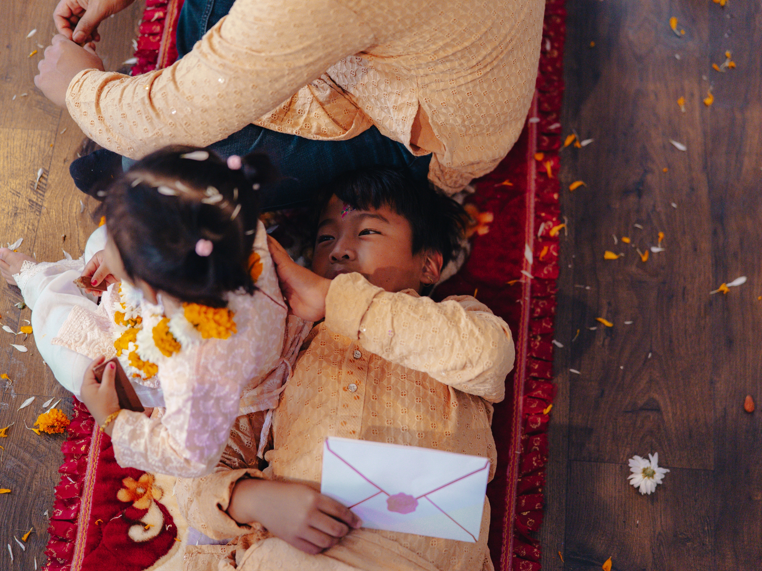 ARU's Soccer for Success head coach, Shabin Subba, hosts young siblings Bianka and Bryan Gurung at his family's home amid festivities in honor of Tihar, the Hindu festival of lights and animals, in Mount Holly Springs, Pa., on Oct. 23, 2025.