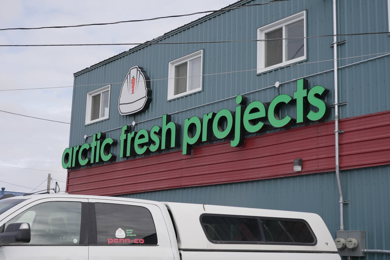 Building with sign that reads "arctic fresh projects".