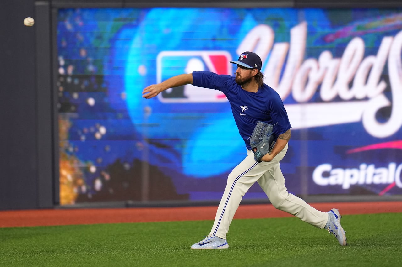 A pitcher throwing during practice.