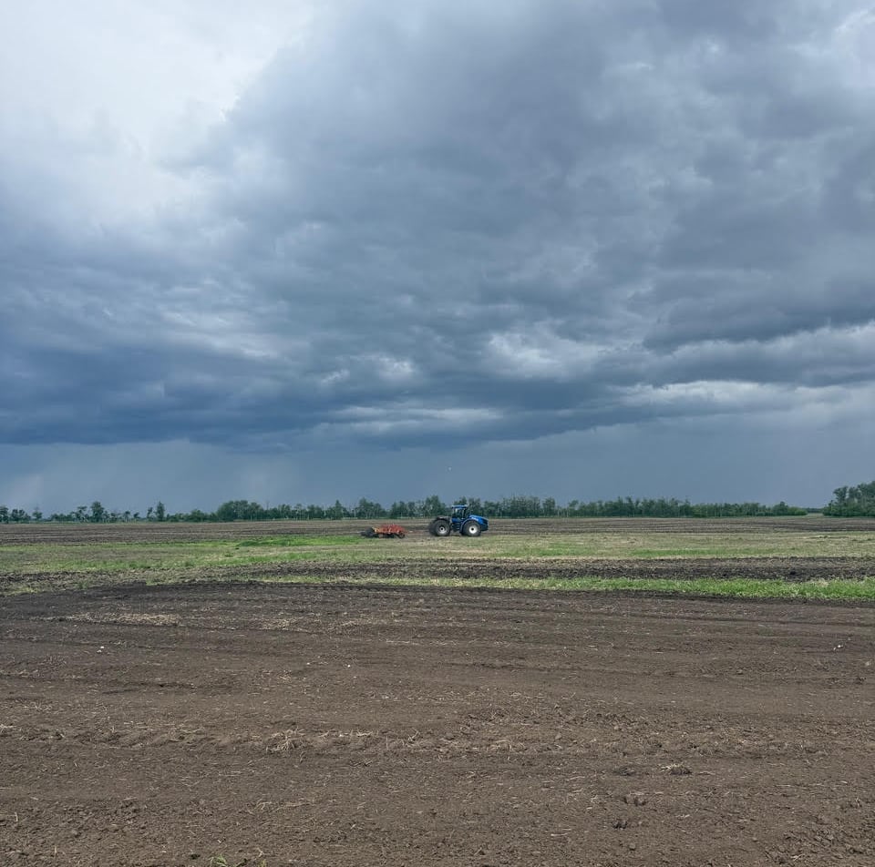 tractor driving on farmland