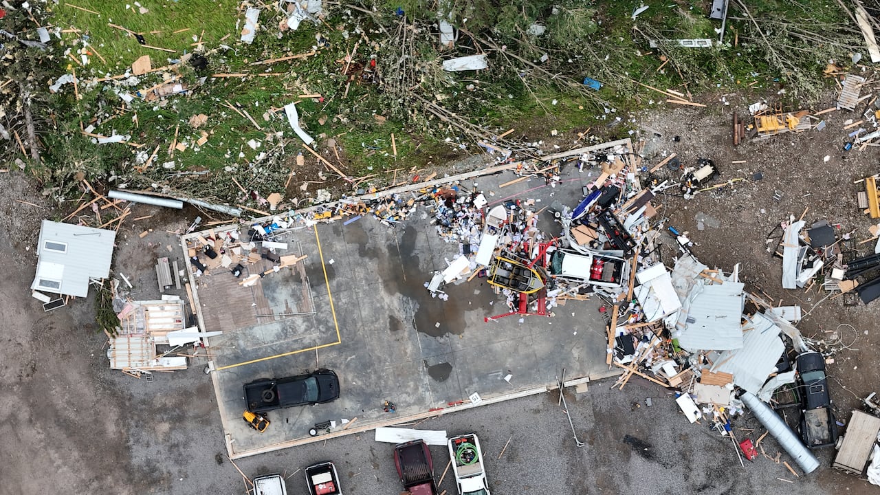 Photo showing severe damage and dispersed debris due to a tornado.
