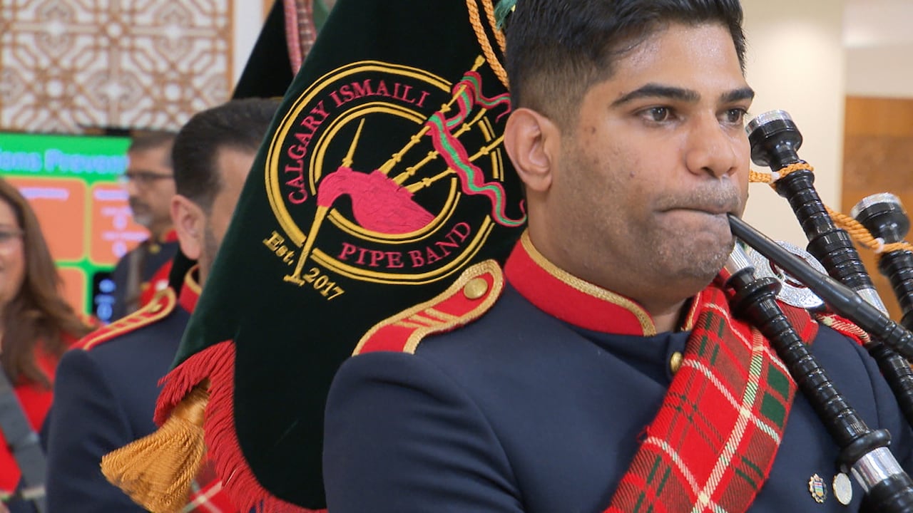 Shahzad Sherwan, captain of the Calgary Ismaili Pipe Band, plays for the community watching on at Generations, in northeast Calgary.