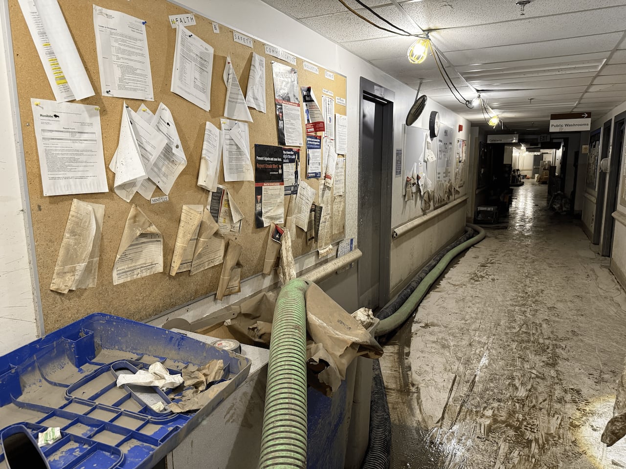 A hallway showing flood damage.