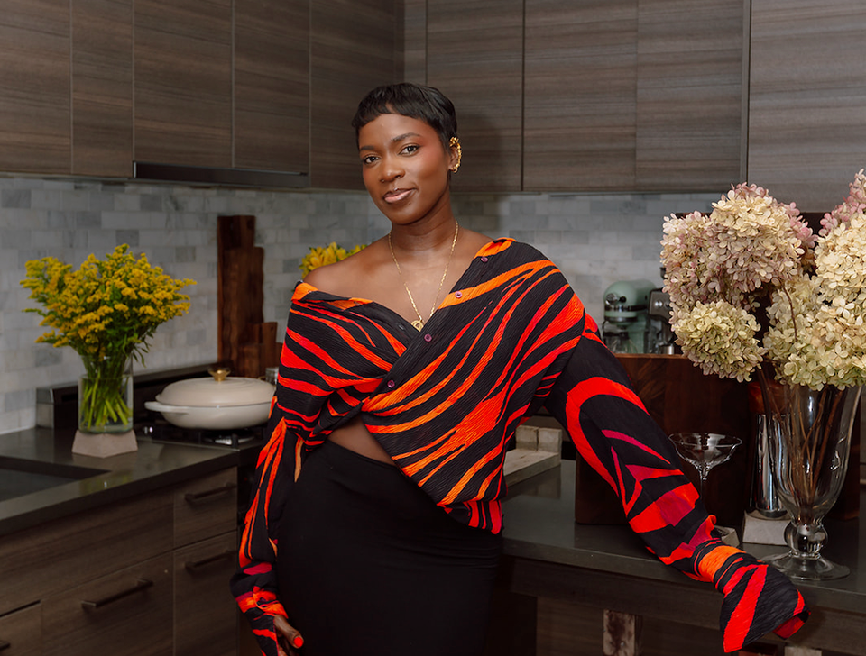 Leonie Badger stands in her kitchen, the place where she creates most of her content.