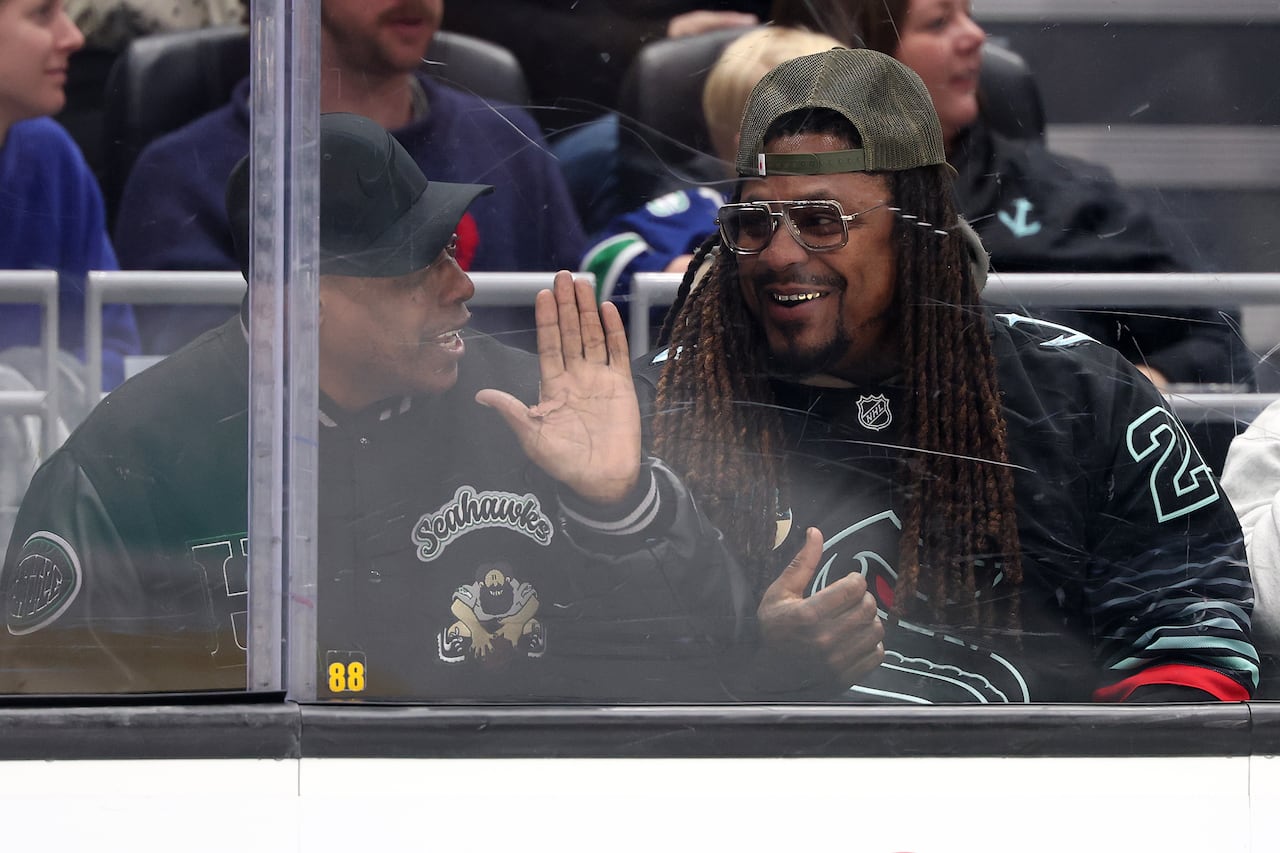 Two male attending a hockey game.