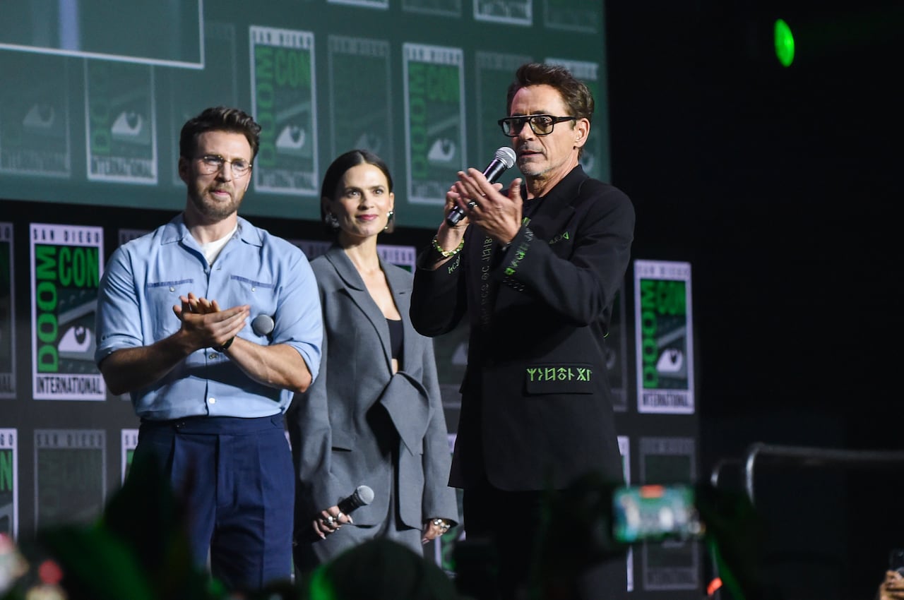 People on stage talk to crowd.