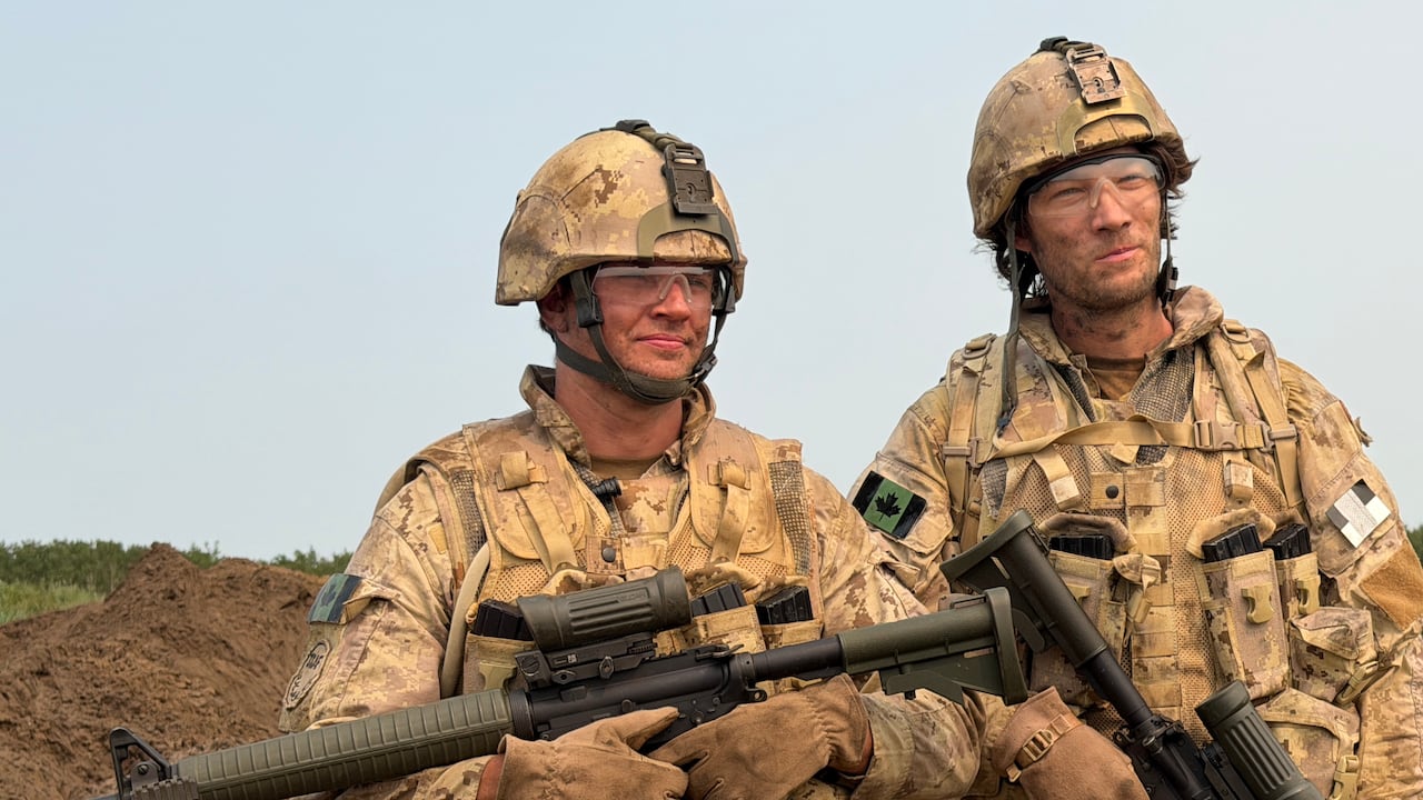 Two men dressed in Canadian military uniforms on set of a Heritage Minute that is being filmed.