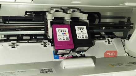Two Printer Ink XL cartridges hanging in a printer