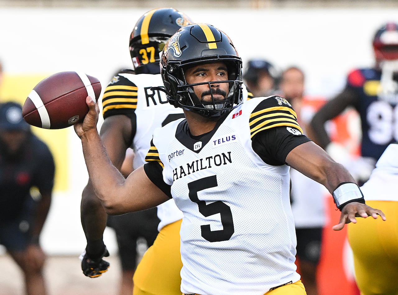 Tre Ford throws a pass during first half CFL football action.