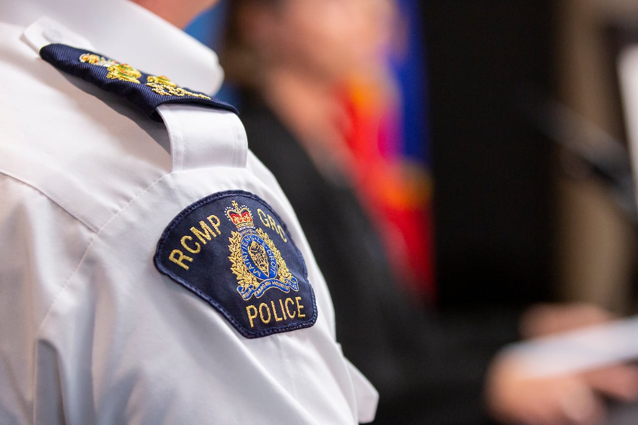 A police officer with his RCMP shoulder badge pictured.