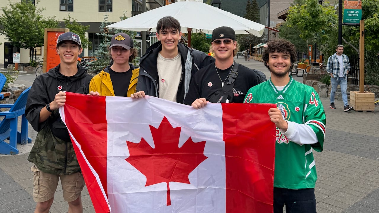CBC Canada Day group photo of young men holding a Canada Day flag