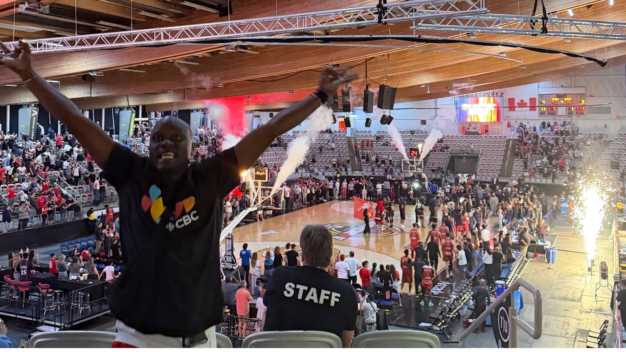 CBC Ambassador Bonfils Munezero on his feet celebrating the Surge victory