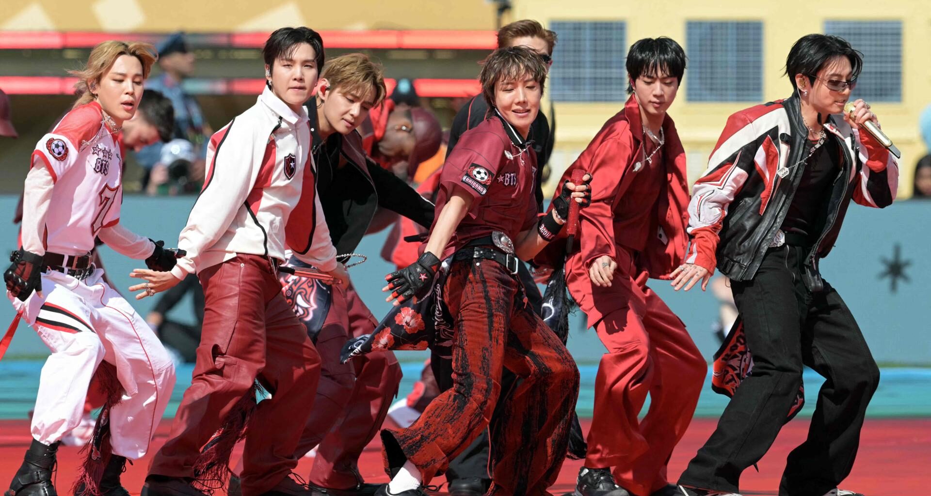 Members of K-pop boy band BTS perform during the 2026 World Cup football tournament