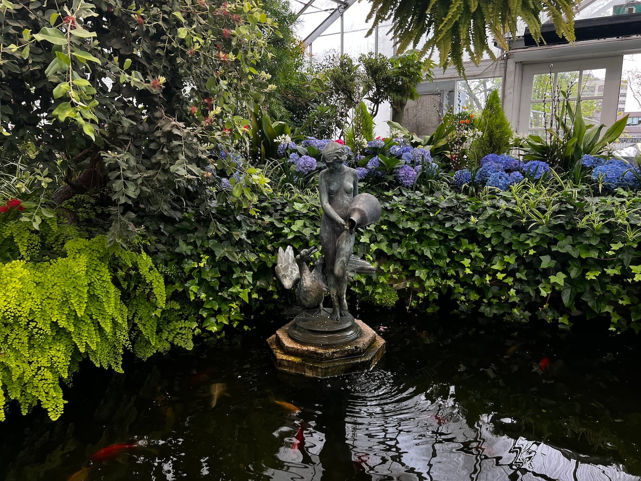 A sculpture on the water, at Palm House in Allan Gardens.