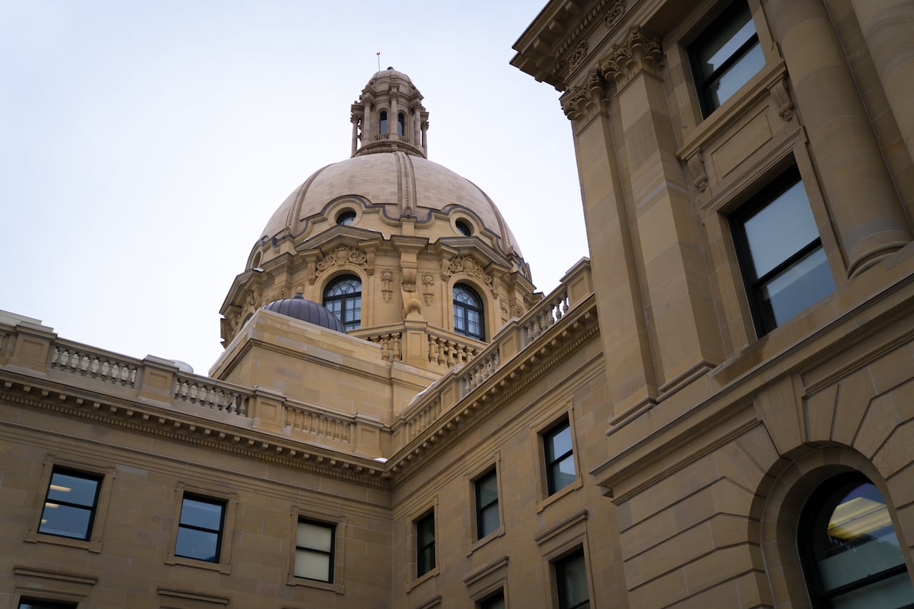 A large sable-coloured stone building with a dome.