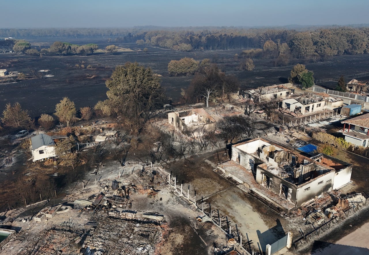 An aerial view of land ravaged by fire.