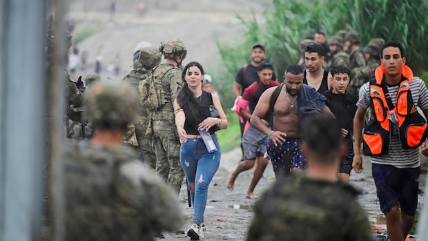 At least 34 migrants dead after thousands breach border into Spain's Ceuta enclave