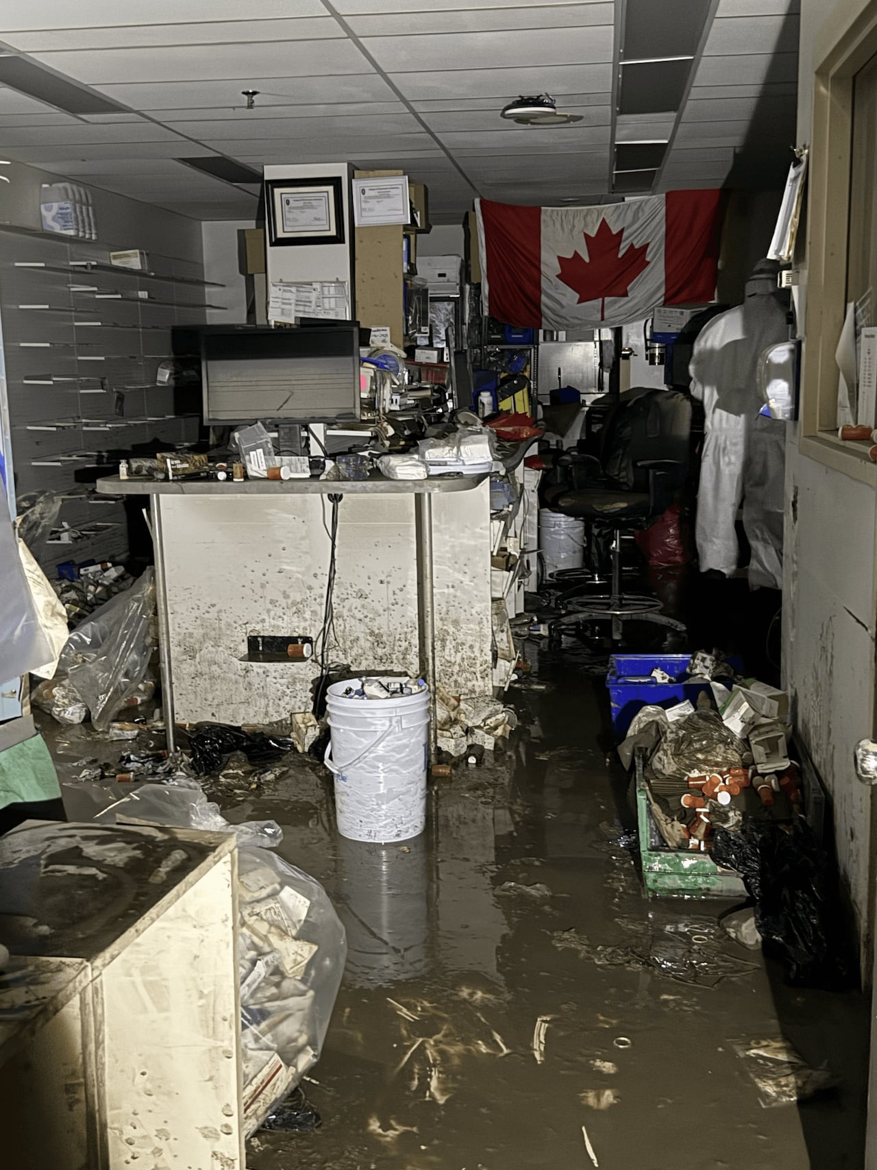 Inside of a pharmacy wrecked by water damage.