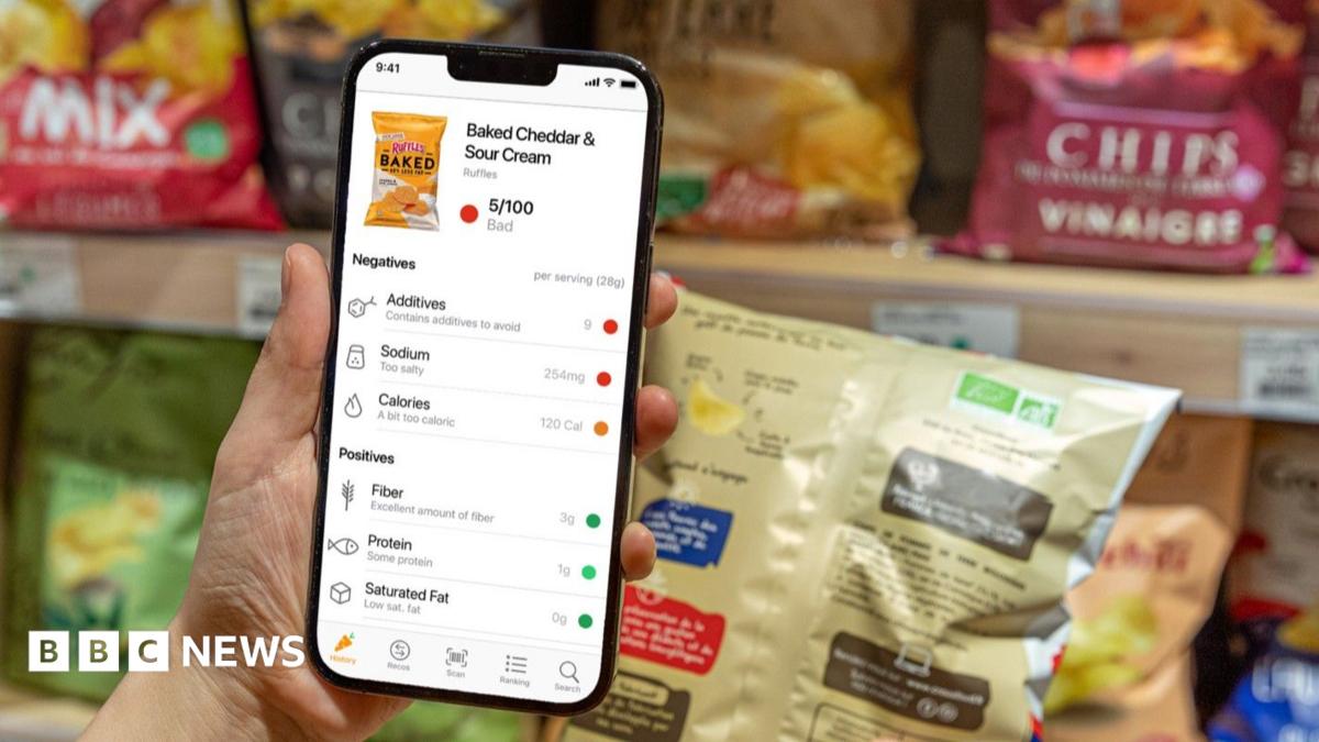 Nathalie uses her phone to scan a product.