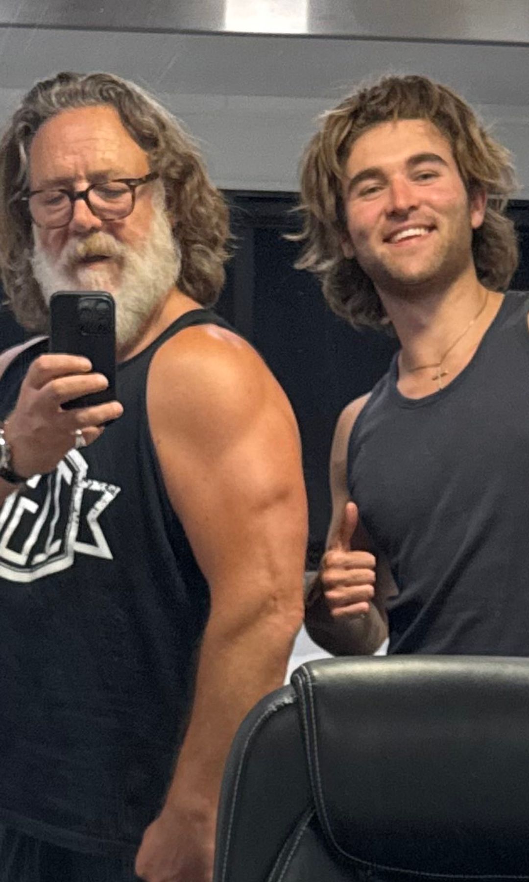 Russell and his son shared a flexing photo in front of the mirror