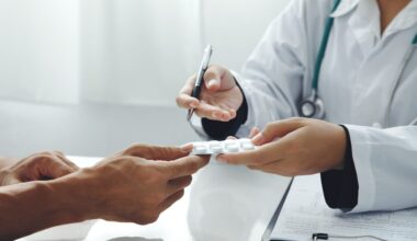 Close up of patient and doctor. Doctor giving prescription to the patient and explain the details of the medication.