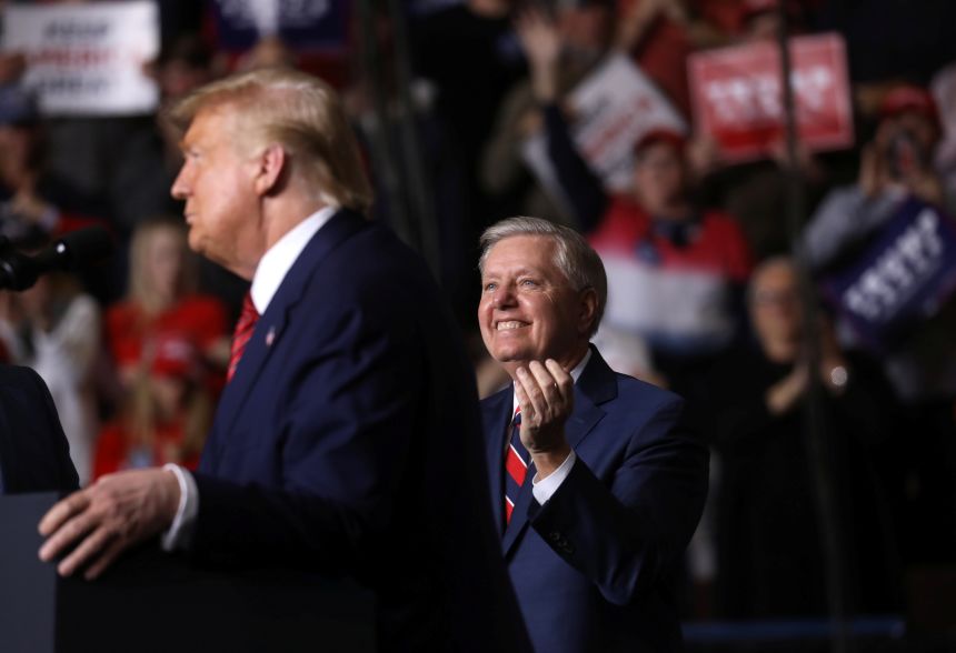 Sen. Lindsey Graham applauds as U.S. President Donald Trump holds a campaign rally in North Charleston, South Carolina, on February 28, 2020.