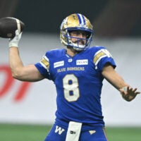 Nov 17, 2024; Vancouver, British Columbia, CAN; Winnipeg Blue Bombers quarterback Zach Collaros (8) looks to throw a pass during the fourth quarter against Toronto Argonauts at BC Place.