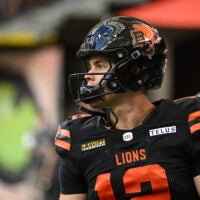 Jun 7, 2025; Vancouver, British Columbia, Canada; BC Lions quarterback Nathan Rourke (12) warms up prior to the game against the Edmonton Elks at BC Place Stadium.