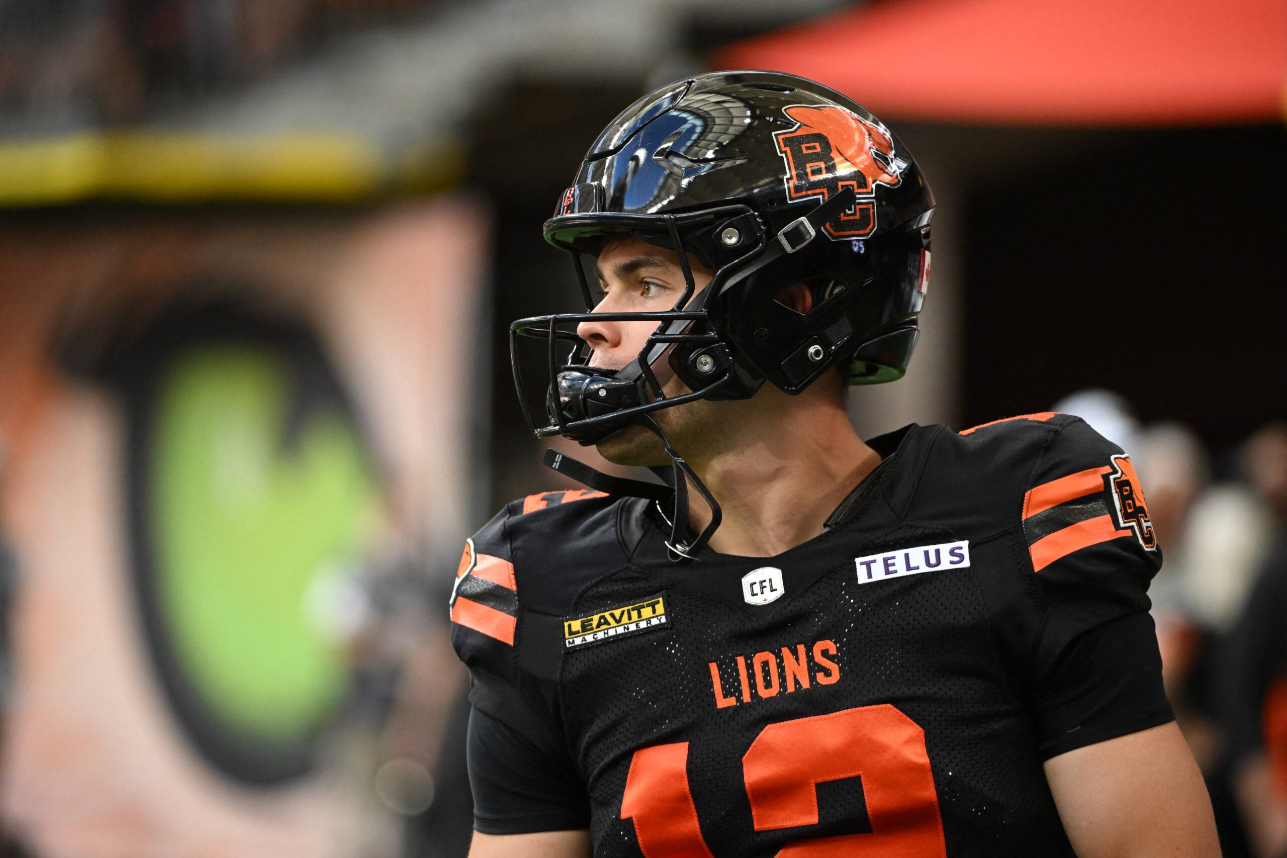 Jun 7, 2025; Vancouver, British Columbia, Canada; BC Lions quarterback Nathan Rourke (12) warms up prior to the game against the Edmonton Elks at BC Place Stadium.
