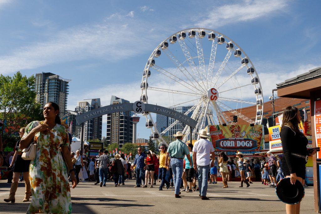 Visitors inside Stampede Park on the fourth day of the Calgary Stampede on Monday, July 7, 2025