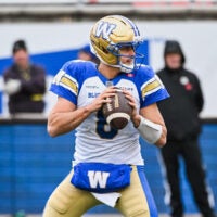 Nov 1, 2025; Montreal, Quebec, Canada; Winnipeg Blue Bombers quarterback Zach Collaros (8) looks to throw the ball against the Montreal Alouettes during the third quarter at Percival-Molson stadium.