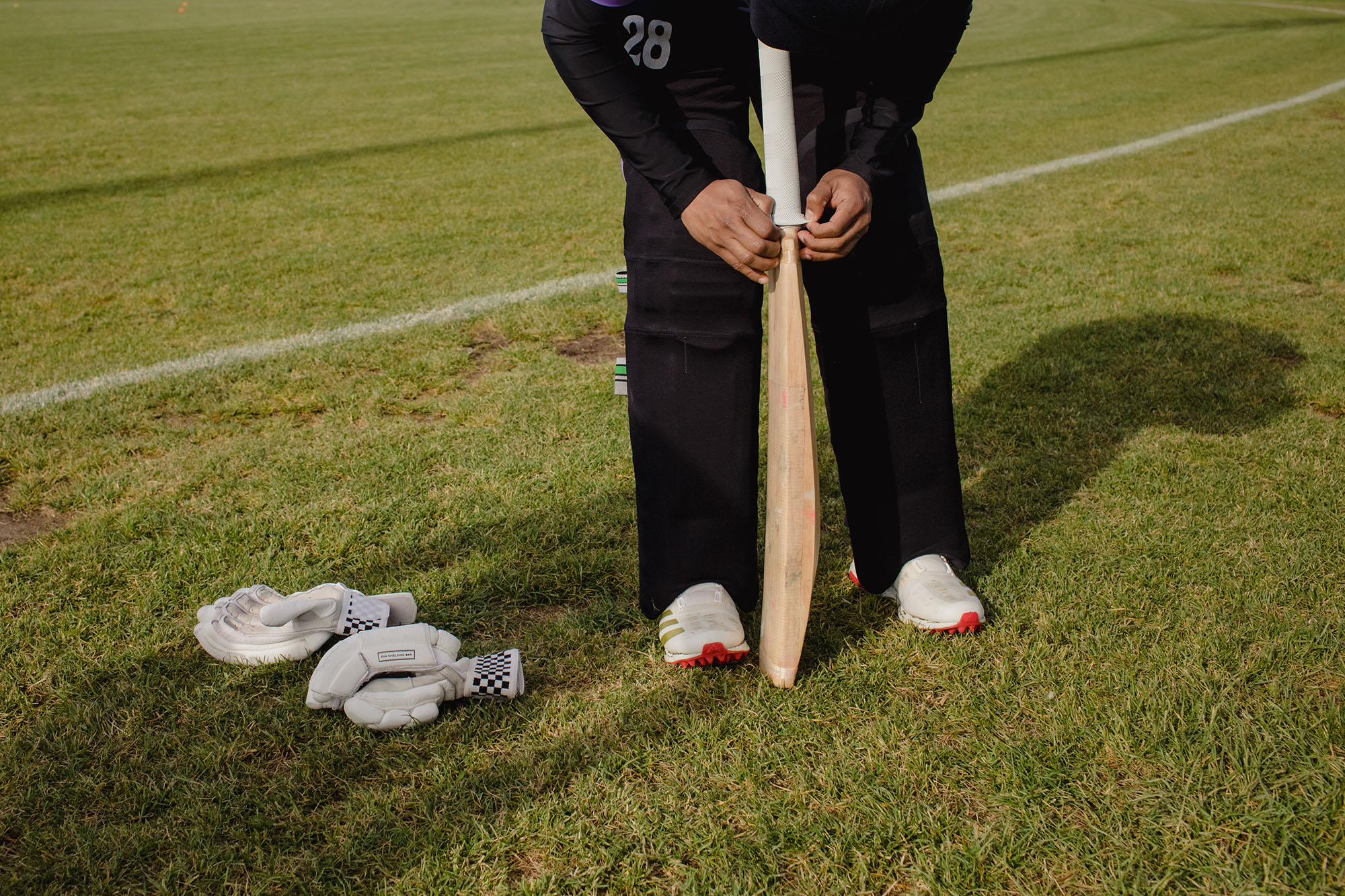 Cricket players prepare for a game at Andrew McCandless Park on a morning in May.