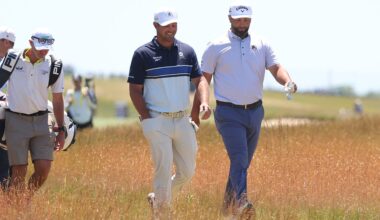 Jun 17, 2026; Southampton, New York, USA; Bryson DeChambeau (L) and Jon Rahm (R) walk together during a practice round for the U.S. Open golf tournament.