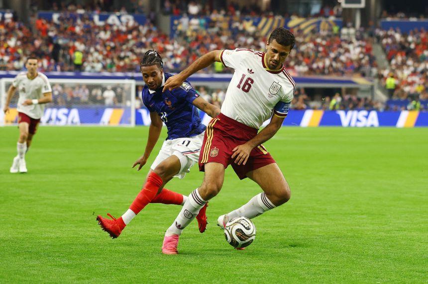 Spanish midfielder Rodri keeps the ball from France's Michael Olise on Tuesday.