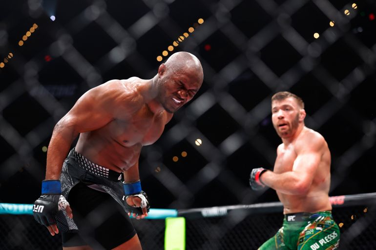 Jul 18, 2026; Oklahoma City, Oklahoma, USA; Dricus Du Plessis (red gloves) fights Kamaru Usman (blue gloves) during UFC Fight Night at Paycom Center. Mandatory Credit: Alonzo Adams-Imagn Images