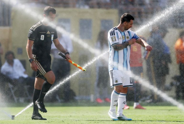 Argentina superstar Lionel Messi, right, during a hydration break at the World Cup