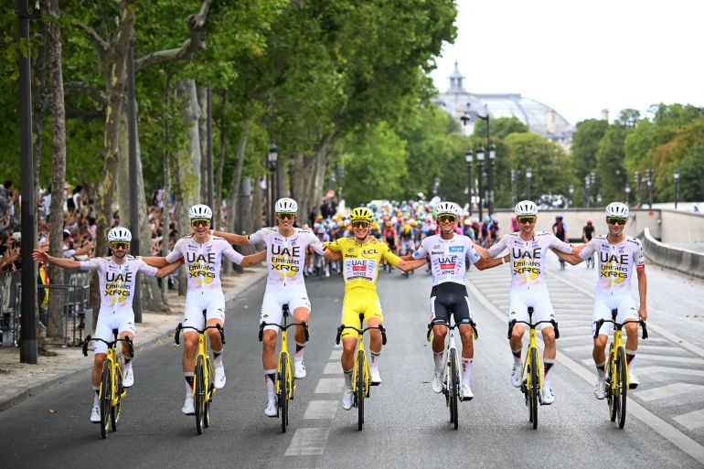 Cycling - Tour de France - Stage 21 - Paris, France - July 26, 2026 UAE Team Emirates XRG's Tadej Pogacar wearing the yellow jersey and UAE Team Emirates XRG's Isaac Del Toro wearing the white jersey celebrate with their teammates after stage 21 Pool via REUTERS/Garnier Etienne TPX IMAGES OF THE DAY