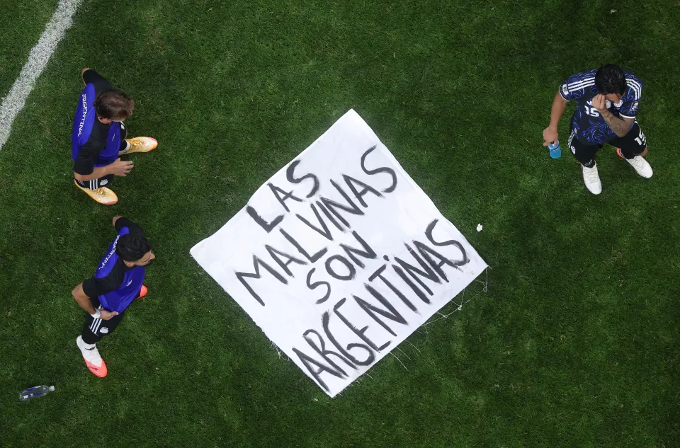 Argentina players with the Falklands banner after the win over England