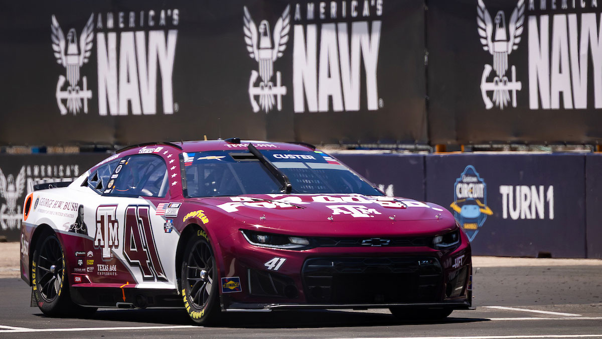 Texas A&M branded George H.W. Bush tribute vehicle driving on the NASCAR track at the Anduril 250 race