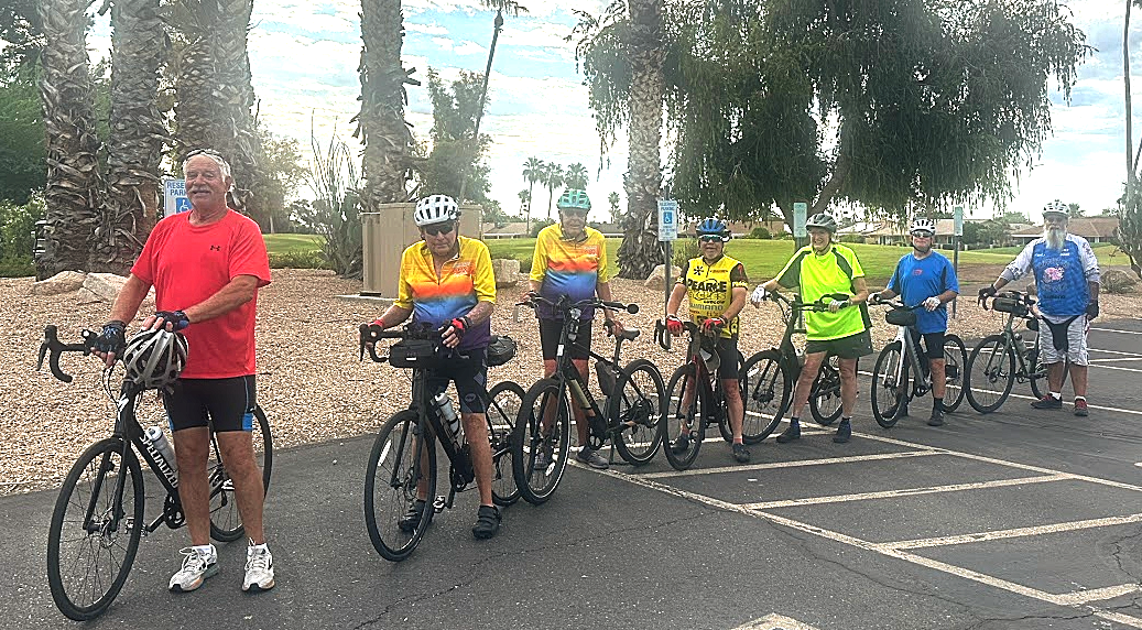 Mike Novak rides a regular bicycle, while Jim Panel, Dave Sayre, Debbie Dorn and Dominick Gagliano ride e-bikes. George Toro is also pictured with an e-bike. This group was riding on a Thursday morning and are called &ldquo;Sun City West Sun-Up Sweaters&rdquo;.
